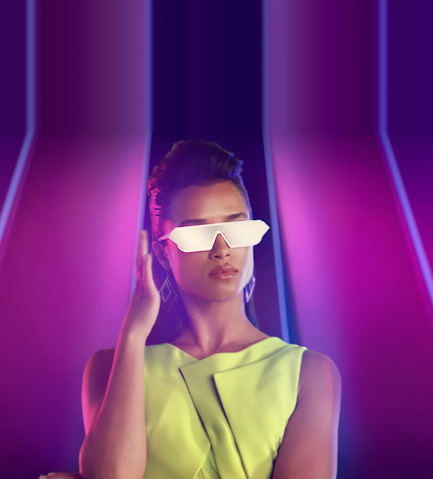 A woman in a lime dress wearing glowing white glasses, lit in violet neon.