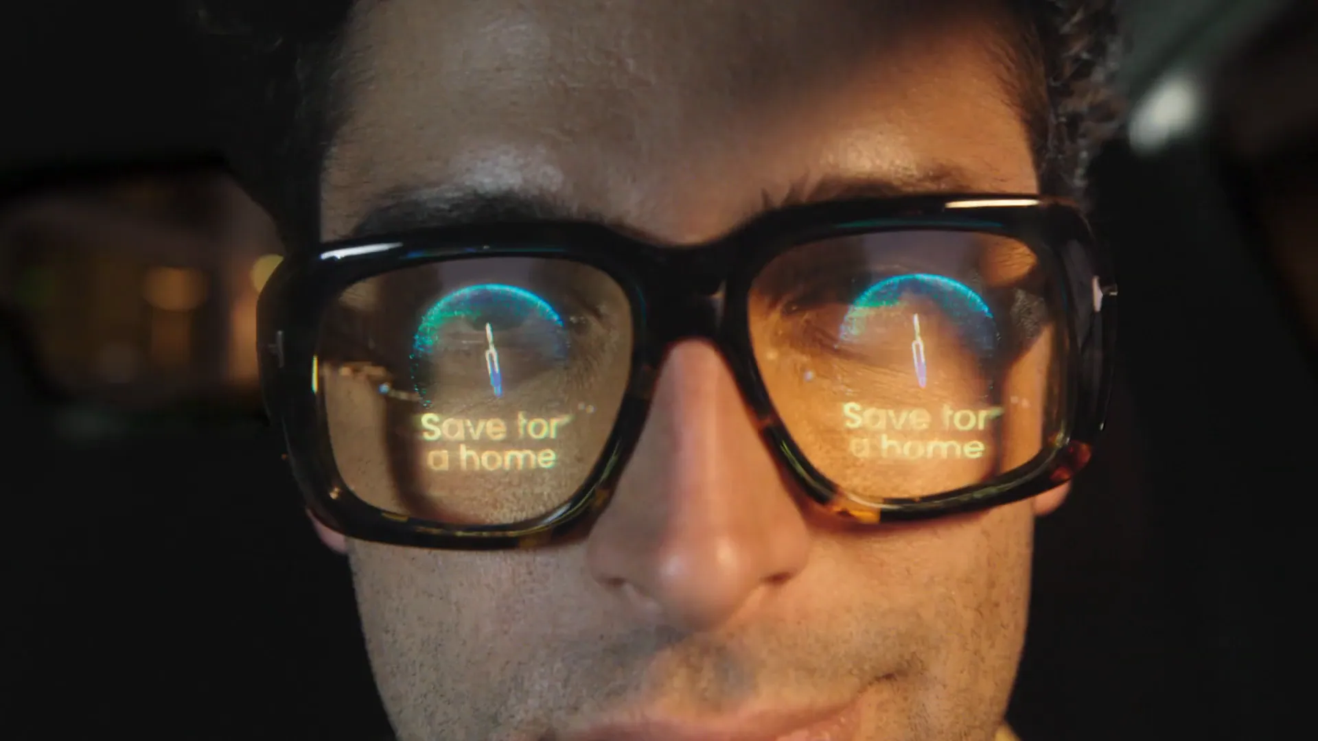 A driver's glasses reflect a floating “Save for a home” milestone.
